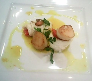 Stuffed plaice fillets with scallops in a saffron sauce